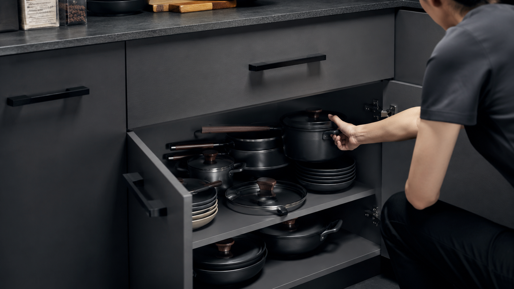 Pot and pan storage problems in deep kitchen cabinets with stacked cookware