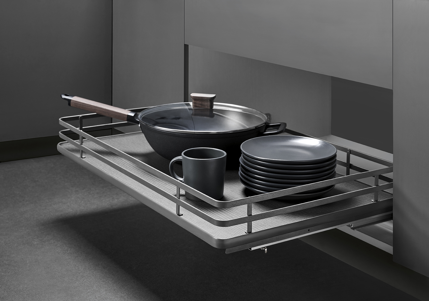 Kitchen pull-out basket for pot and pan storage in modern cabinets